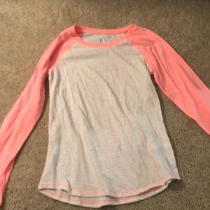 Long sleeve Justice shirt with pink arms and dots